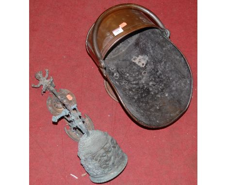 A Victorian copper helmet shaped coal scuttle together with an ornamental hanging wall bell