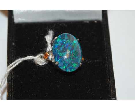 A silver and cabochon opal set dress ring, size O -