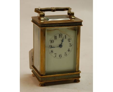 An early 20th century lacquered brass cased carriage clock, having white enamel dial (a/f), visible platform escapement and s