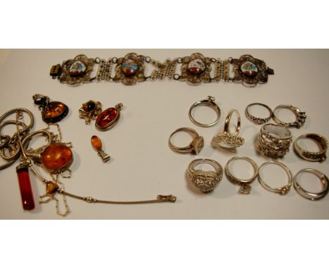 A collection of principally modern costume jewellery to include; enamel, amber, and porcelain set brooches and pendants, brac