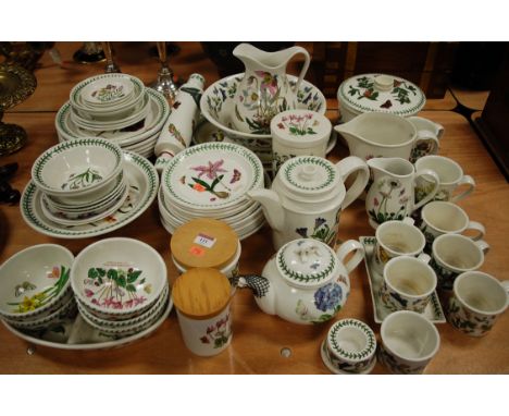 A large collection of Portmeirion Botanic Garden tablewares to include; jug and bowl, rolling pin, storage jars etc 