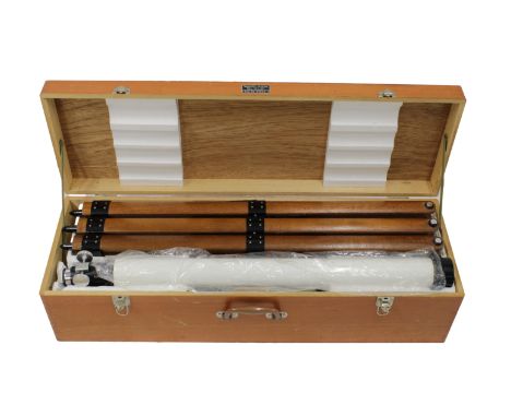 A boxed Tasco 60mm telescope, made in Japan, 500x 240x 150x, reg no. 57500, in white, break-down wooden tripod legs, held in 