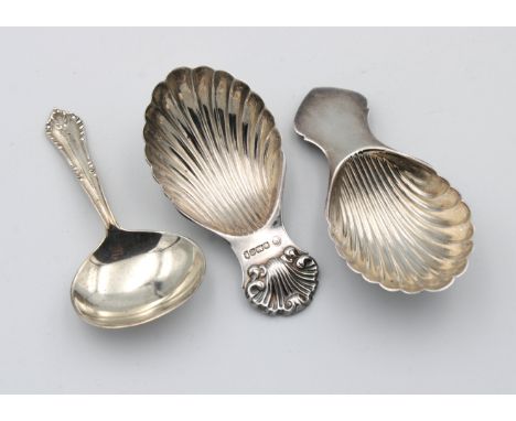 Two silver caddy spoons, by Francis Howard Ltd, two of scallop shell form, together with another, 1.95 tr.oz. (3)