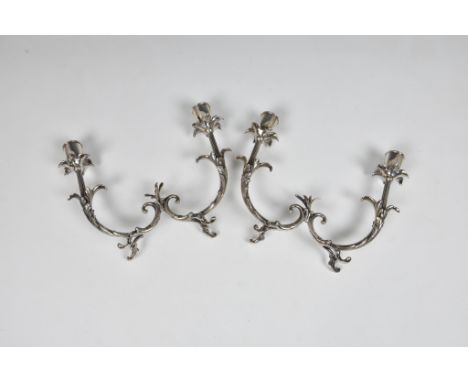 A pair of Italian silver twin branch table candelabra, stamped 800 and lozenge mark, having flower head sconces, 17.5cm. high