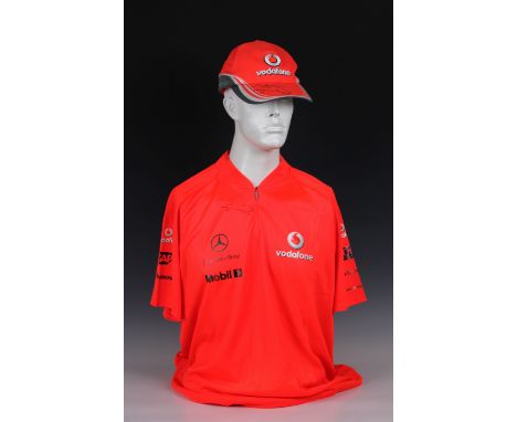 A Vodafone McLaren Mercedes official F1 team bright orange Hugo Boss XL polo / T-Shirt, signed below neck line in black marke