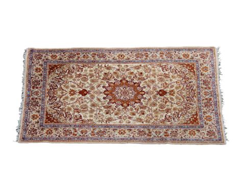 A part-silk Isfahan Zaronim rug, the central sixteen pointed star medallion on an ivory ground decorated with an overall mean