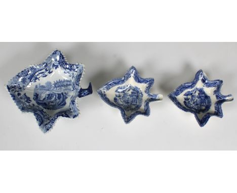 Three early 19th century transfer printed blue and white ceramic pickle dishes, vine leaf form, one near pair and one larger,