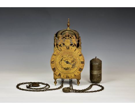 A late 19th century lantern clock, in the 17th century style, the four pillar, weight driven movement with strapped bell, urn