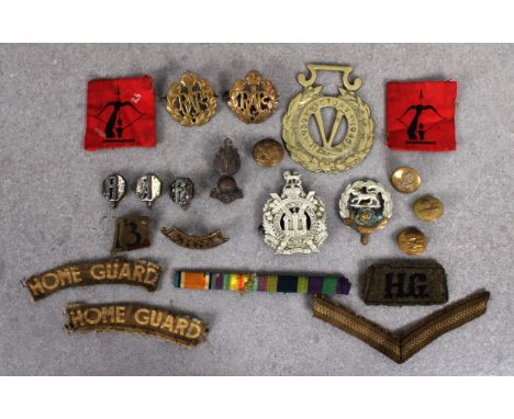 A collection of military badges comprising two RAF brass beret badges, together with three RAF brass buttons, three cufflinks