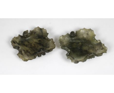 A pair of Chinese spinach jade pin dishes, of shaped square leaf form, 9.6cm. square. (2)