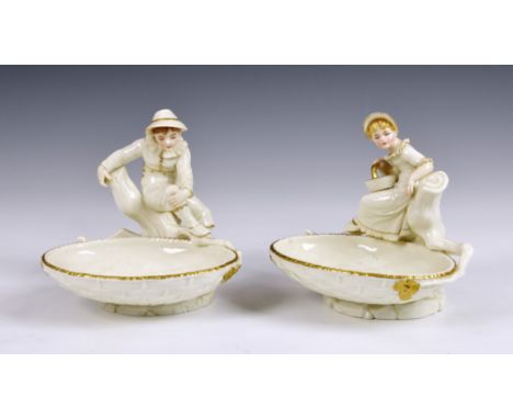 A pair of Royal Worcester figural sweetmeat dishes, modelled by James Hadley, after Kate Greenaway, in the white picked out i
