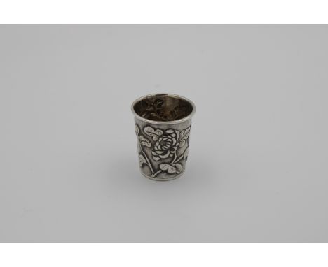 A Chinese silver Hung Chong tot cup, probably early 20th century, of typical cylindrical tapering form, embossed with floral 