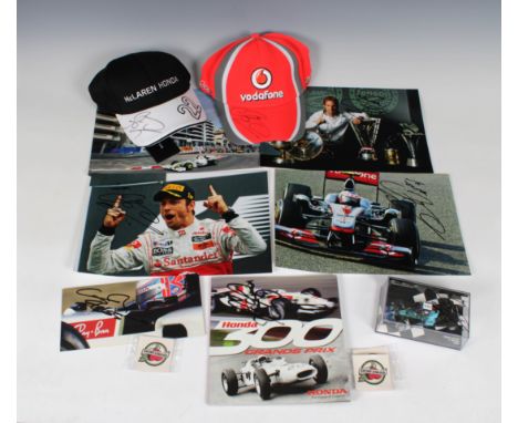 A collection of Jenson Button F1 memorabilia, to include a McLaren Honda &amp; McLaren Vodafone Jenson hat, both signed in bl