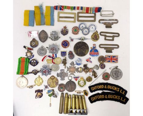 Assorted enamel and other badges, and a group of militaria
