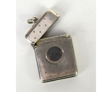 Silver vesta case with engine turned and dot decoration and vacant cartouche, by H &amp; A, Birmingham 1908, sirns pat       