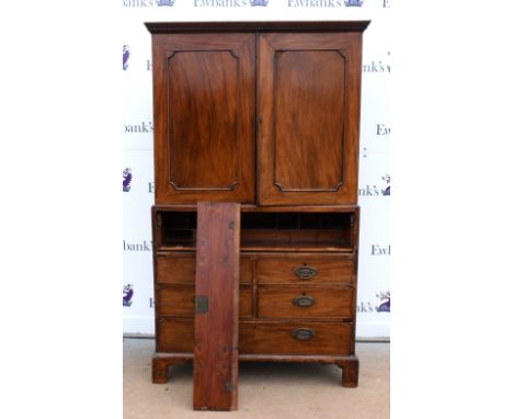 19th century mahogany secretaire cabinet, the top section with panelled doors enclosing slides and shelves, over secretaire d