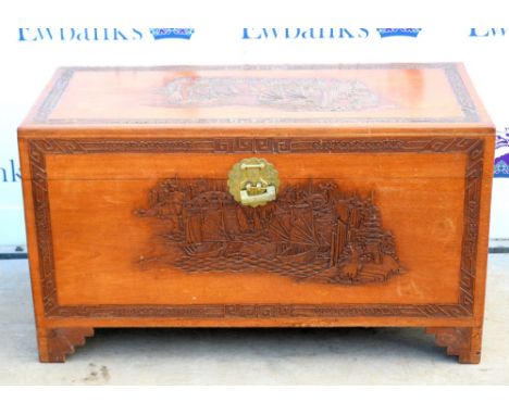 Chinese camphorwood coffer, carved with junks at sea, on bracket feet (one detached but present), H59 x W104 x D51cm        