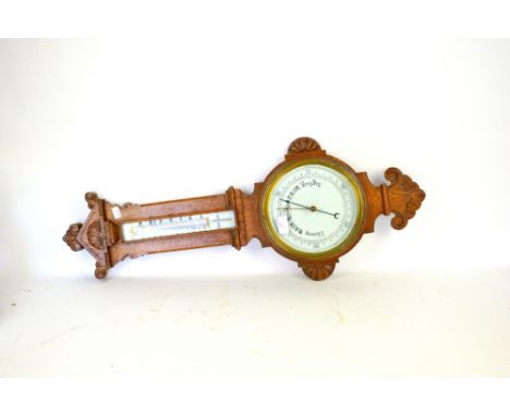 Carved oak aneroid barometer,        