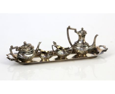 Miniature silver tea service on tray Birmingham 1905 comprising, tea pot, coffee pot, cream jug, sugar bowl and tray, togethe