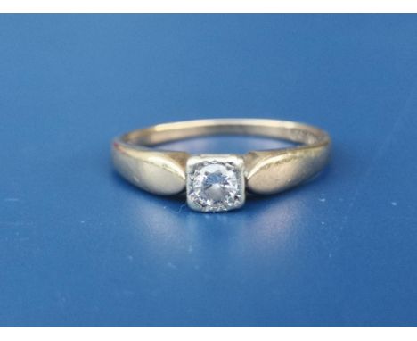 A small 9ct gold diamond solitaire ring.  Finger size L/M