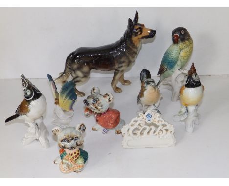 A Goebel porcelain alsatian, 7" high and seven various small animal figures. (8)