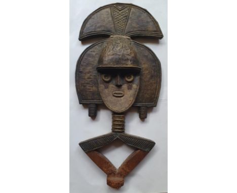 An African carved wood figural panel with sheet metal decoration - from the studio of Robert Lenkiewicz,. 23.3".