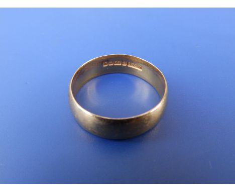 A 22ct gold wedding ring - Birmingham marks.  Finger size R.