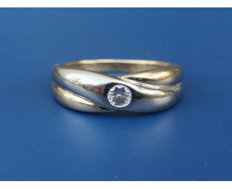 A yellow &amp; white metal band ring set with a single diamond.  Finger size O/P.