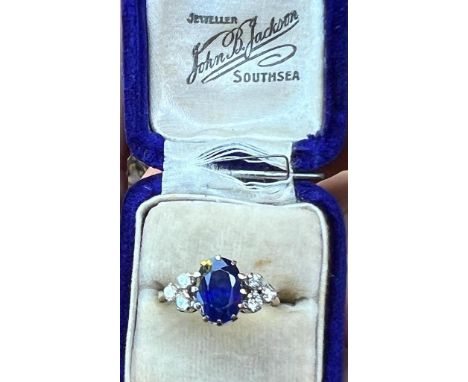 A certified natural 2.62 carat Burmese sapphire &amp; diamond ring, the oval claw-set cushion cut sapphire flanked by six sma