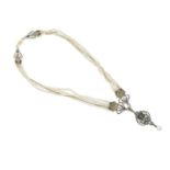 CARLO GIULIANO: COLLIER PERLES DE SEMENCE, EMAIL, PERIDOT ET DIAMANTS, CIRCA 1880