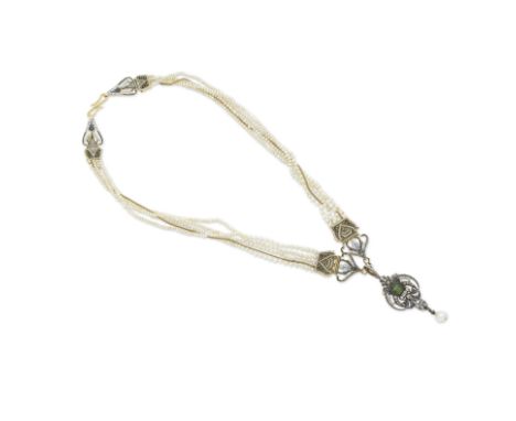 CARLO GIULIANO: COLLIER PERLES DE SEMENCE, EMAIL, PERIDOT ET DIAMANTS, CIRCA 1880Le collier formé de quatre rangs de perles d