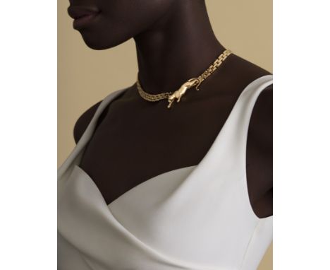 CARTIER: COLLIER OR, 'MAILLON PANTHÈRE', CIRCA 1980Formant une panthère stylisée, les yeux sertis d'émeraudes de forme ronde 