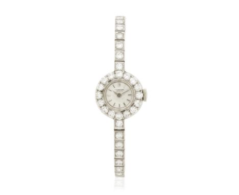 INTERNATIONAL WATCH CO.: MONTRE BRACELET DE DAME DIAMANTS, CIRCA 1960Le cadran circulaire, la lunette et le bracelet sertis d