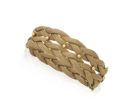 BRACELET ORFormant deux rangs d'une maille souple tressée, centrée d'une ligne de billes en or jaune, poinçon français d'impo