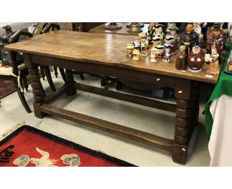 An 18th Century oak refectory table on bobbin turned legs CONDITION REPORTS Length:180cm, Width:75cm, Height 77cm