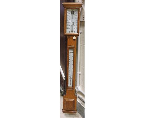 A Victorian oak stick barometer, the dial inscribed "Spridion &amp; Son, Opticians, Cardiff"