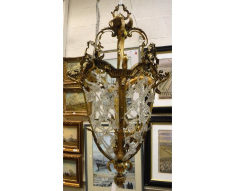 A 20th Century lacquered brass and glass bead latticework decorated ceiling light in the 19th Century manner