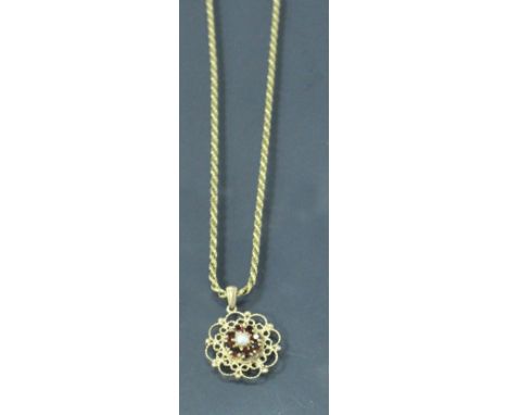 A 9 carat gold pearl and garnet set pendant on 9 carat gold chain 12 g