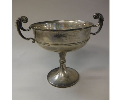 A George V silver trophy cup with two scrollwork handles, the main body inscribed "Puckeridge Hunt open race 1924 won by J.A.