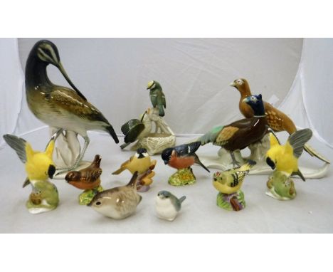 A collection of various bird ornaments including Karl Ens figure of an "Avocet", Karl Ens figure of "Two nesting Tits", Metzl