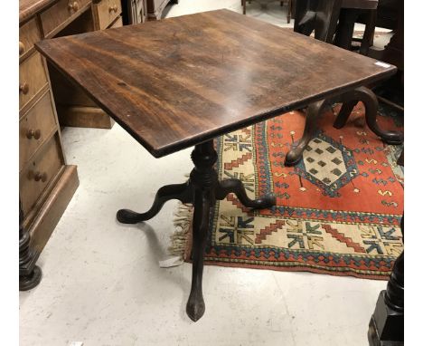 A late George III mahogany tea table, the rectangular snap top on a turned pedestal to tripod base CONDITION REPORTS 70cmx70c