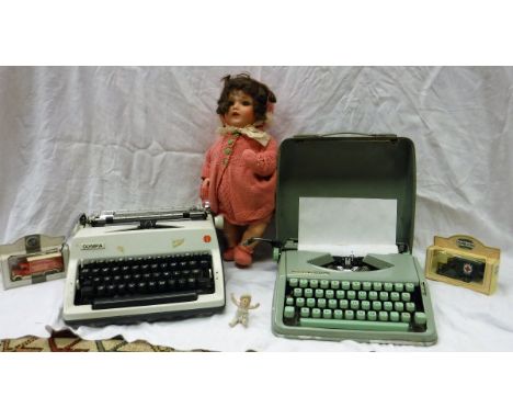 A Hermes Baby manual typewriter, an Olympia manual typewriter, dolls and a small collection of LPs including Queen "Jazz", Fr