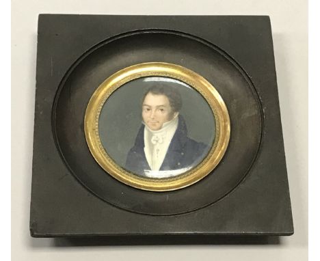 A 19TH CENTURY ENGLISH SCHOOL "Young Gentleman with Blue Overcoat and White Shirt", circular miniature portrait study, oil on