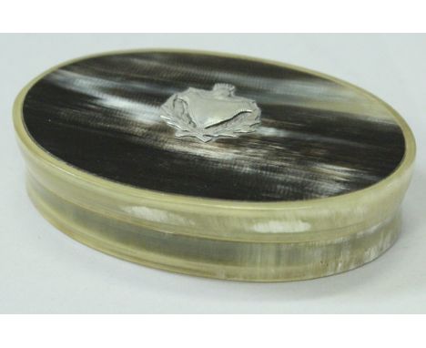 A Scottish white metal mounted horn snuff box of oval form