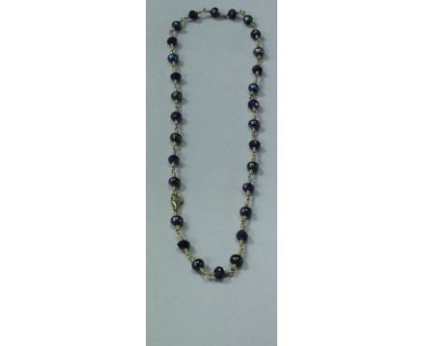 A 9 carat gold hermatite and amethyst bead necklace