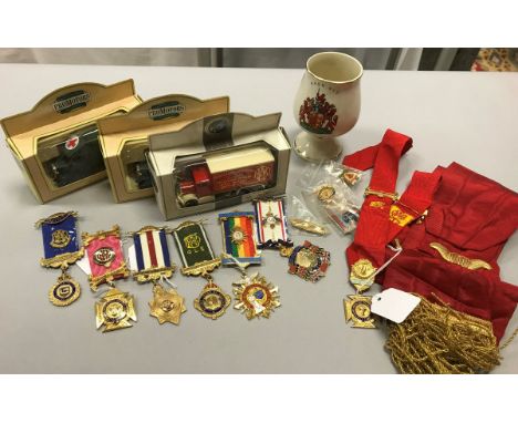 A collection of ROAB medallion, badges, sash and a Prinknash Abbey goblet relating to The Royal Antediluvian Order of Buffalo