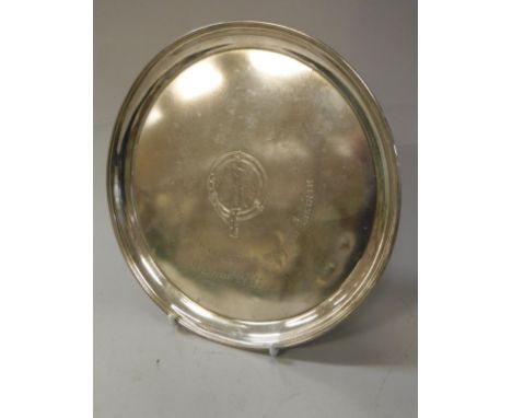 A late 19th Century Russian silver salver, the centre field decorated with an armorial within a belt inscribed "omr Apmucmobe