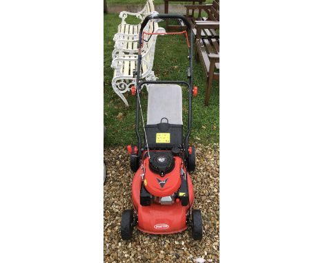 An Austin Mini Mower petrol driven lawn mower with Wolf 4/98 cc engine