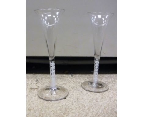 A pair of 18th Century enamel twist ale flutes