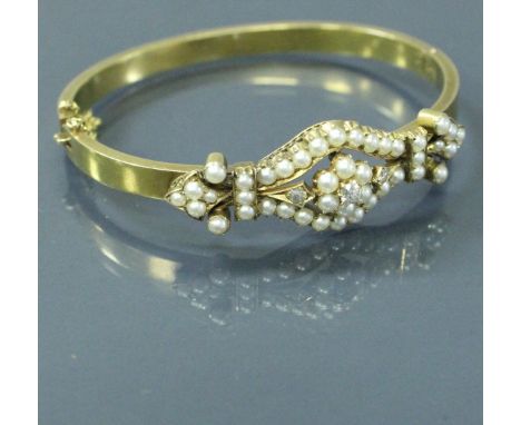 An un-tested 18 carat gold Victorian bangle set with diamonds and pearls, 15 g, housed in a "West &amp; Son, 18 and 19 Colleg
